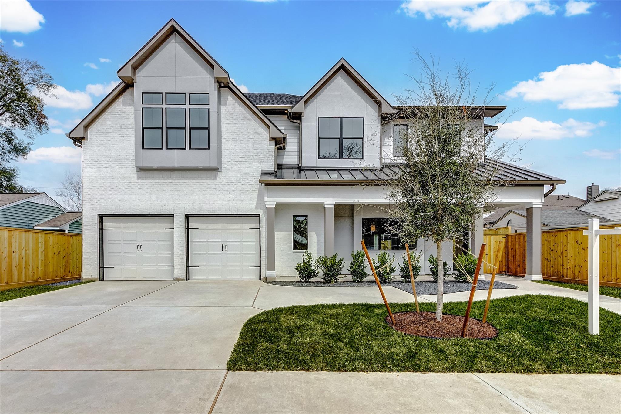 Contemporary white-brick home at 6522 Westview with tall windows and a covered front porch